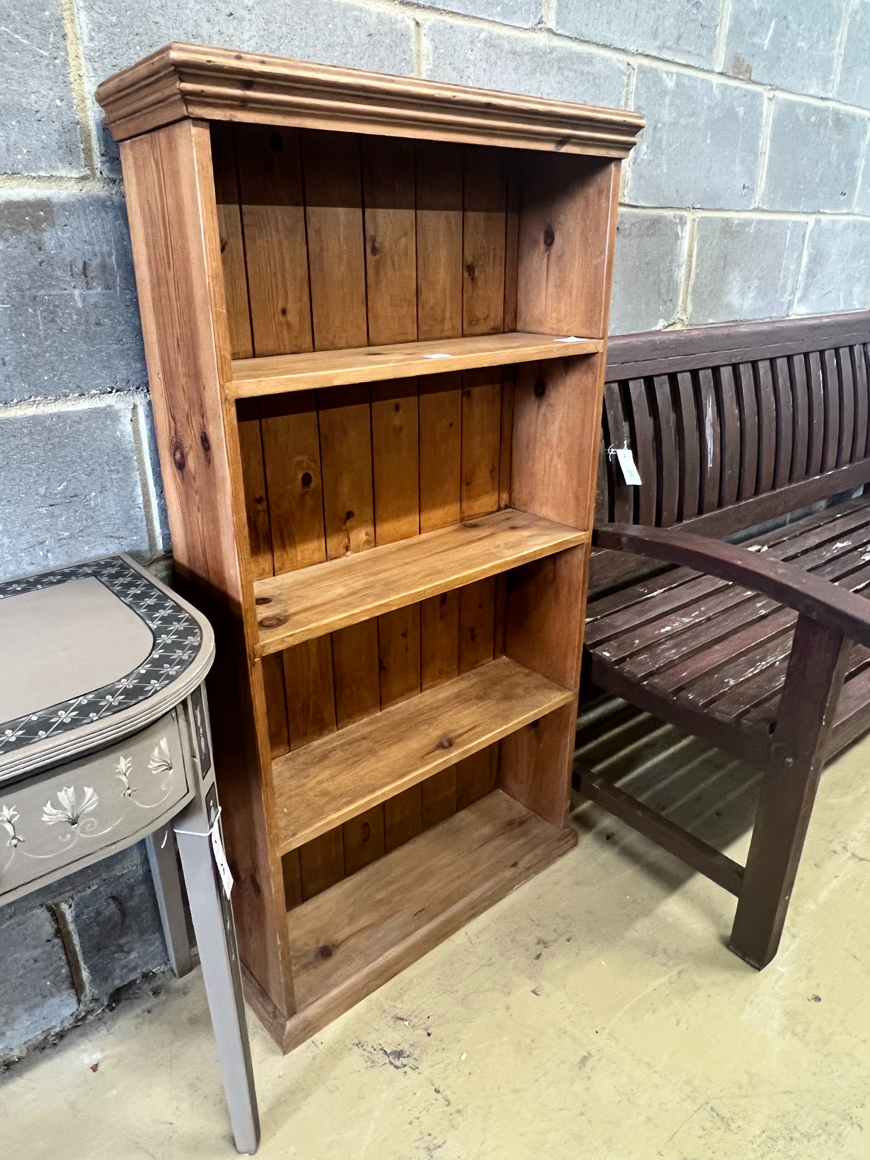 A pine open bookcase, width 66cm depth 21cm height 125cm
